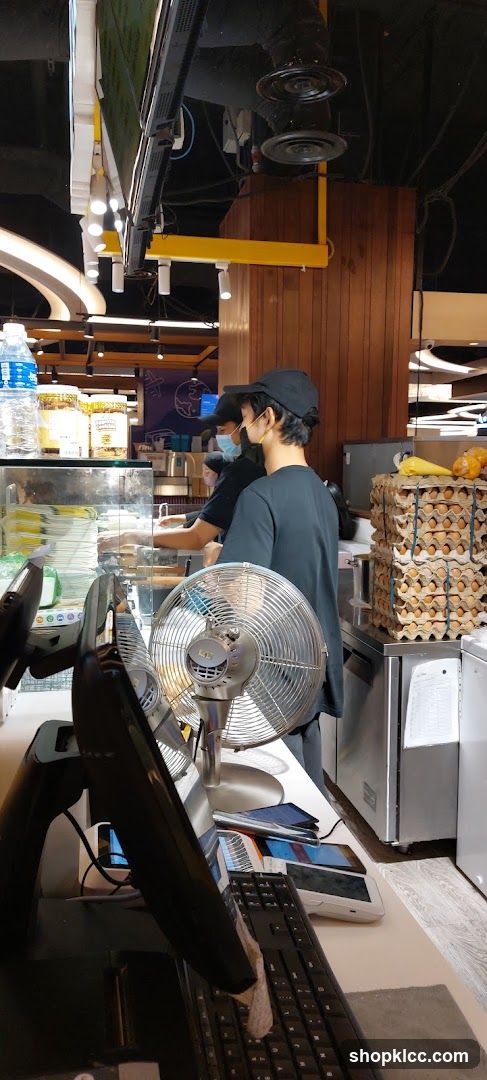 Staff preparing food behind a counter