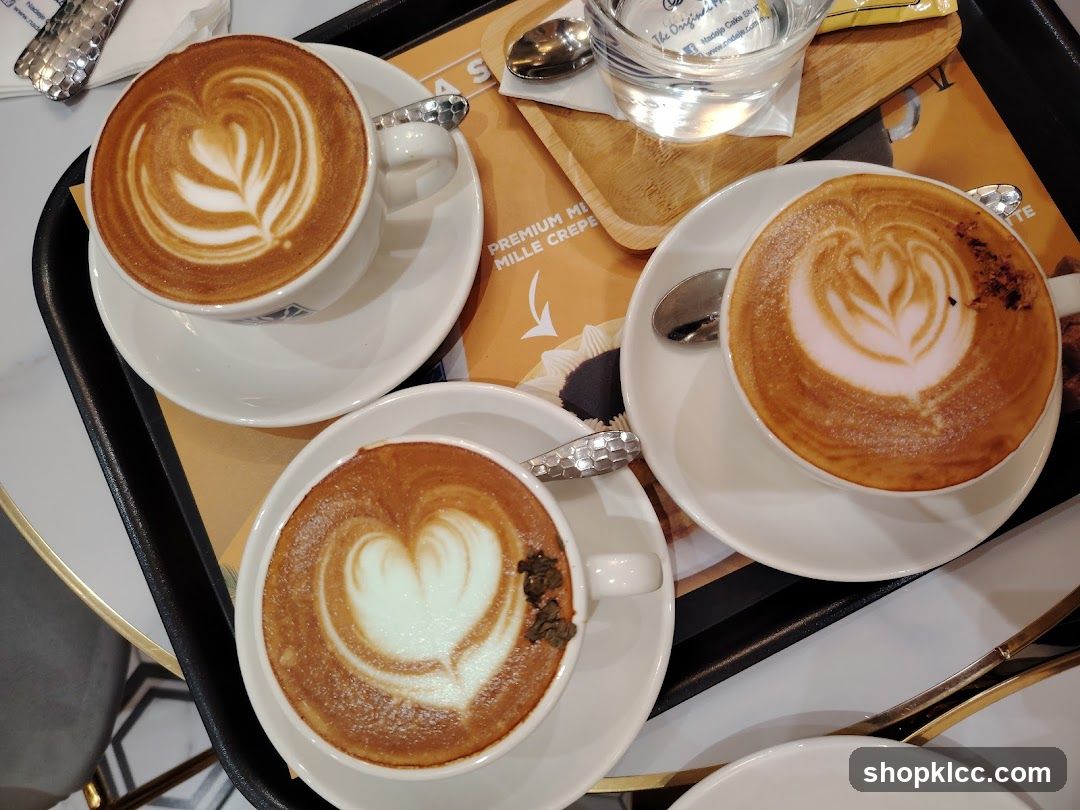 Three coffees with latte art