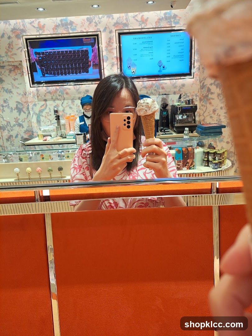 Woman taking a selfie with an ice cream cone