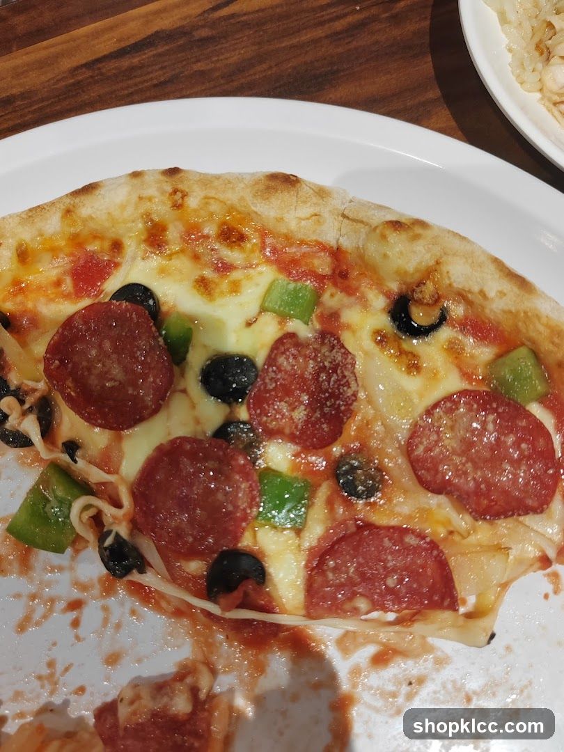 Pepperoni and Vegetable Pizza Slice