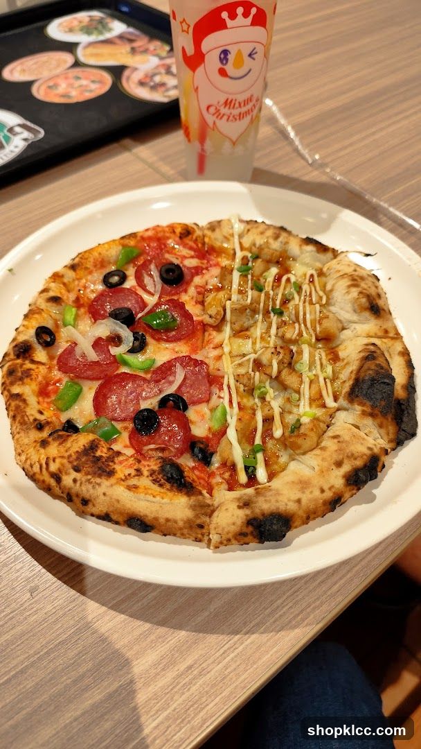 Pizza with mixed toppings and festive drink