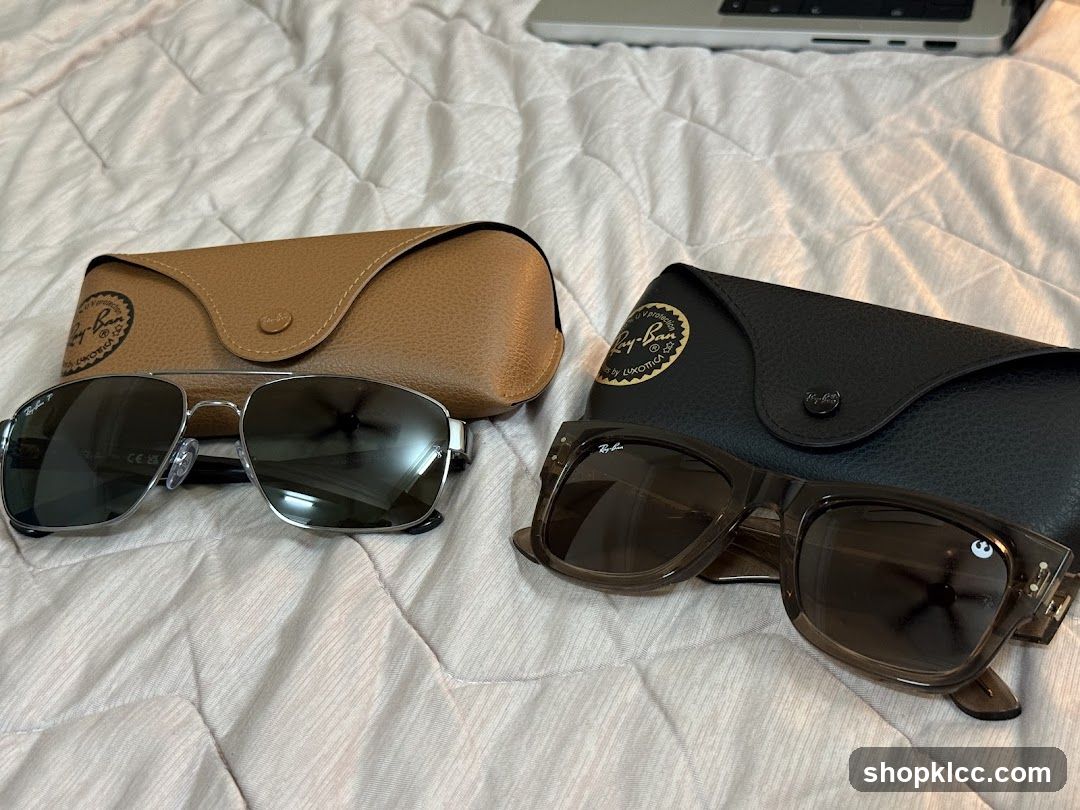 Sunglasses and Cases on Bed