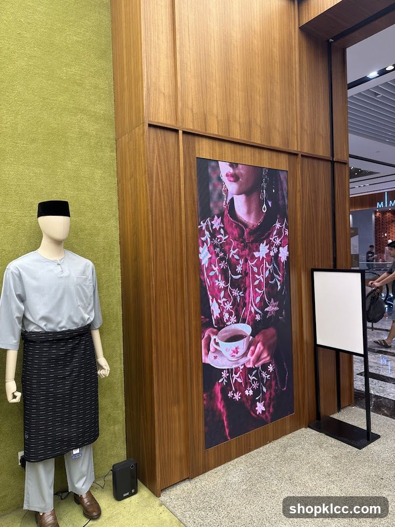 Mannequin in traditional attire and digital display