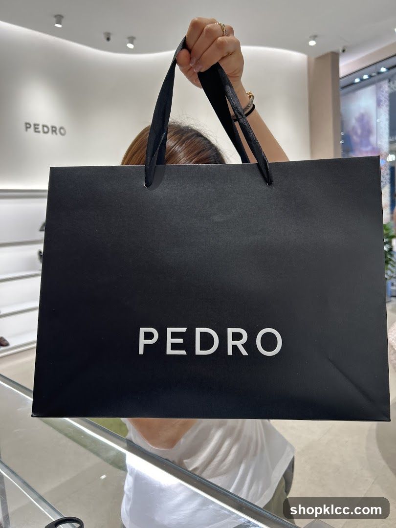 Person holding a shopping bag
