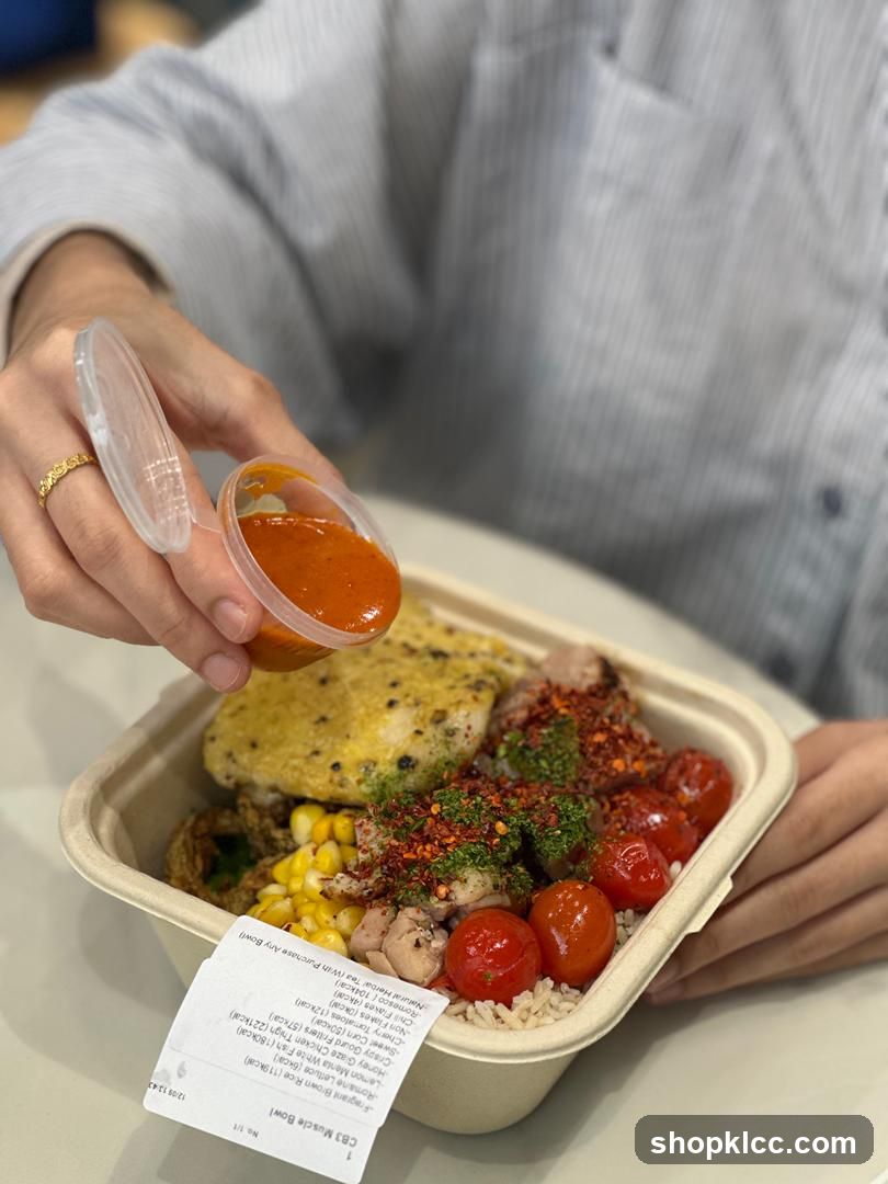 Person adding sauce to a bowl