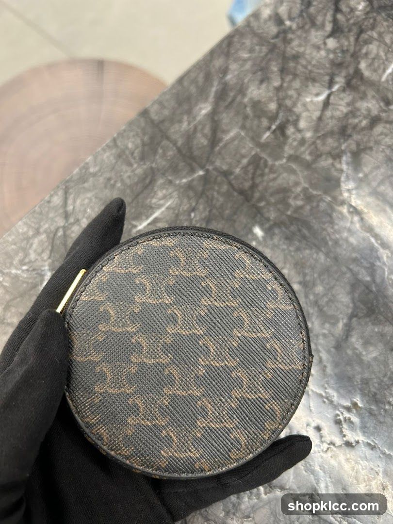 Round coin purse with monogram pattern