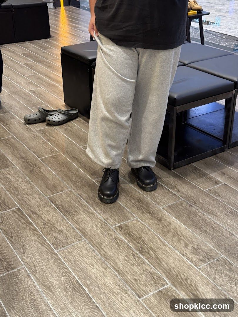 Person wearing Dr. Martens shoes