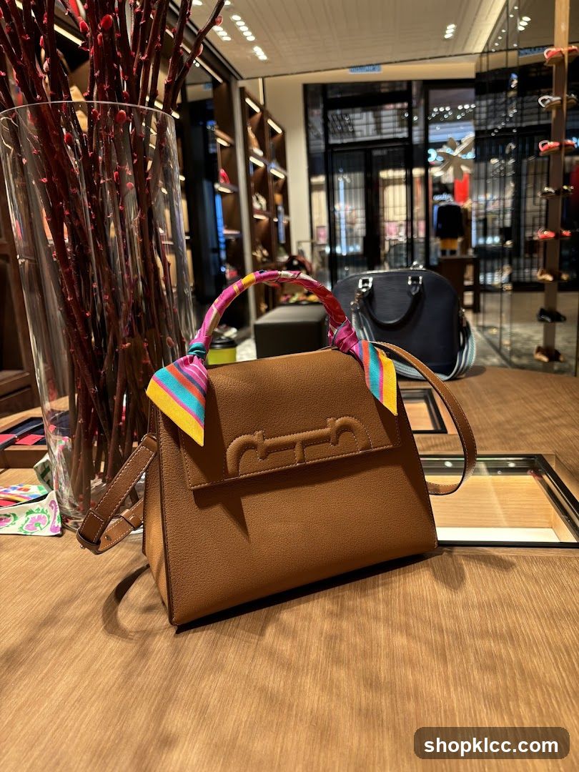 Brown handbag with colorful scarf on display
