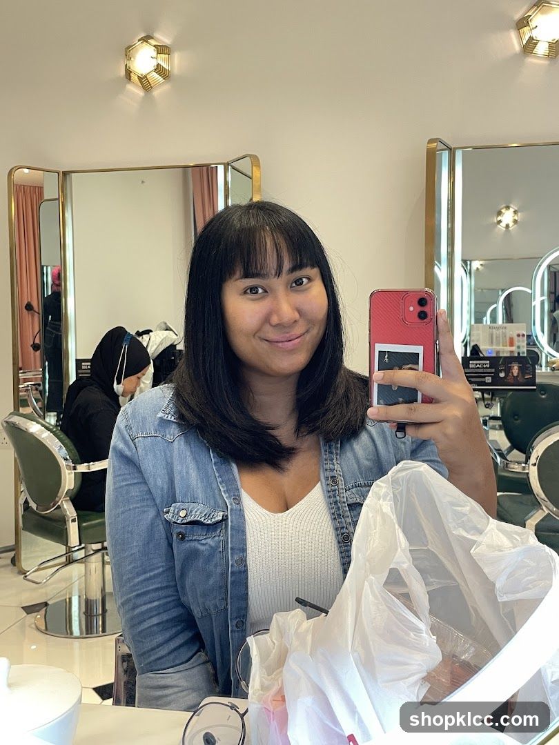 Woman taking a selfie in a salon