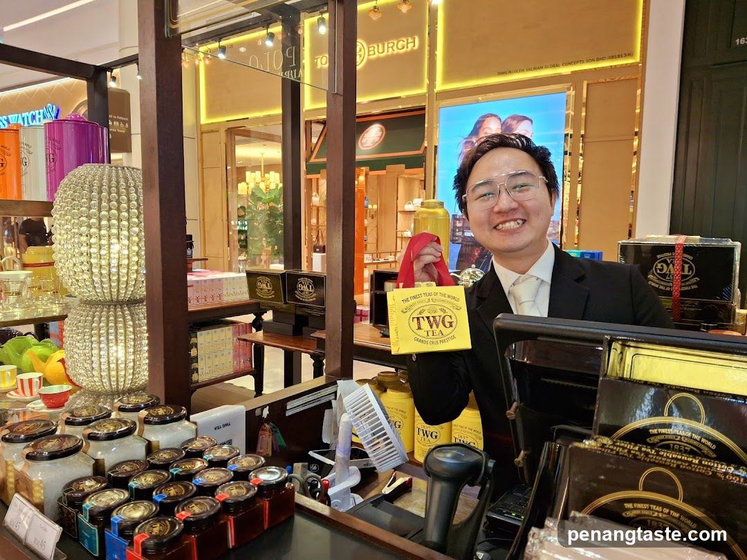 Man holding TWG Tea gift bag