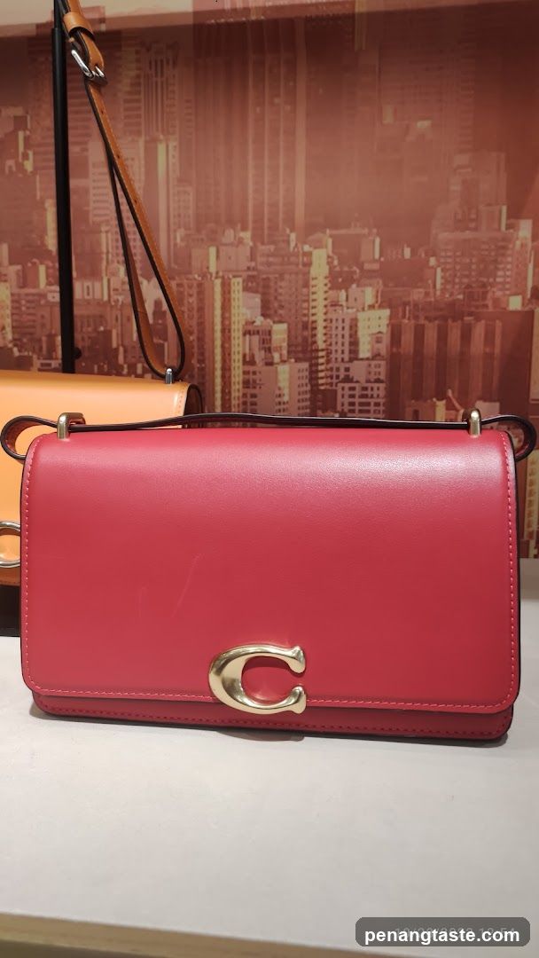 Red handbag with gold C logo