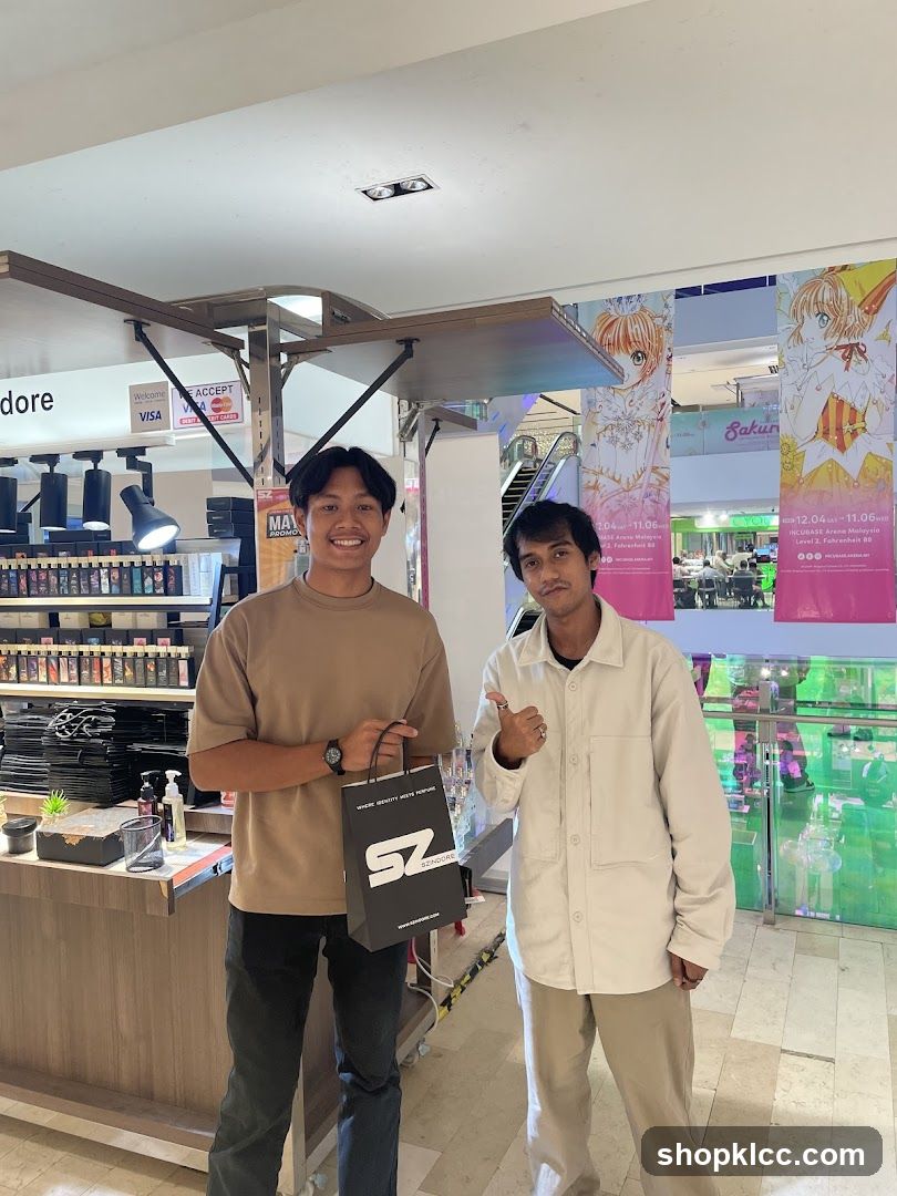 Two men posing with a shopping bag