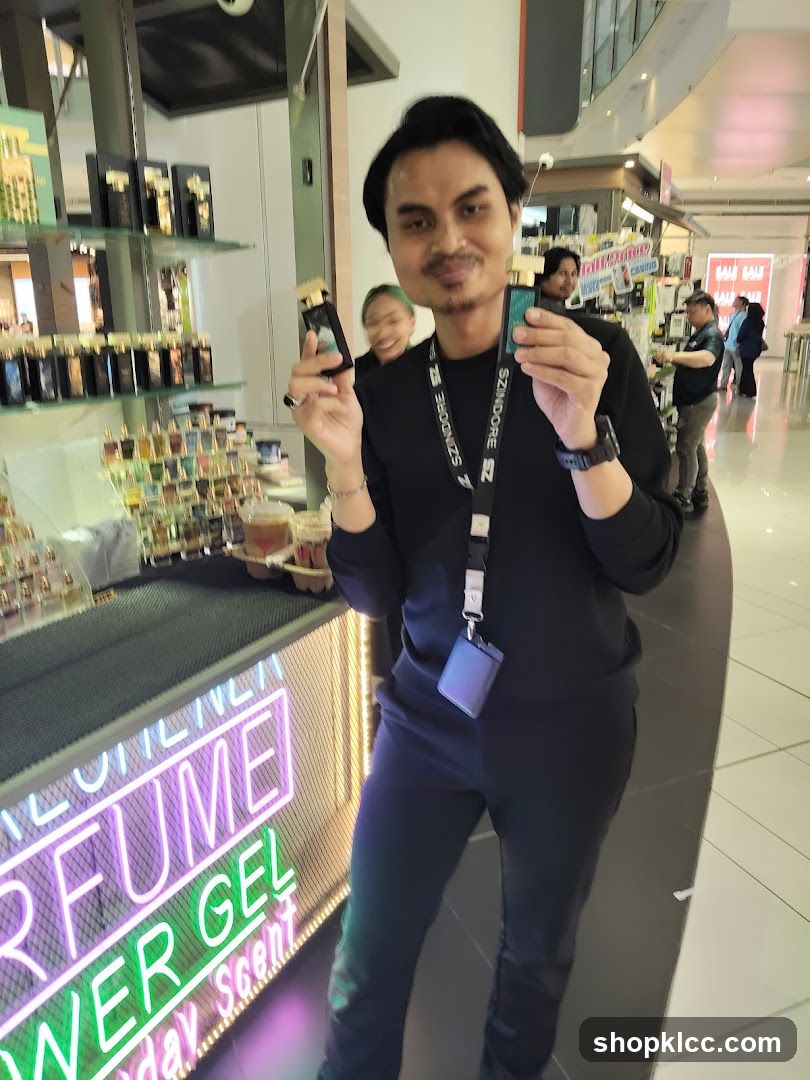 Man holding perfume bottles