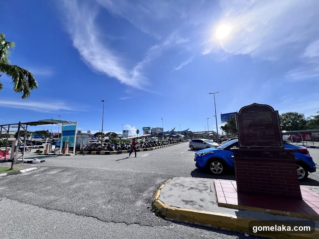 Outdoor parking area with monument
