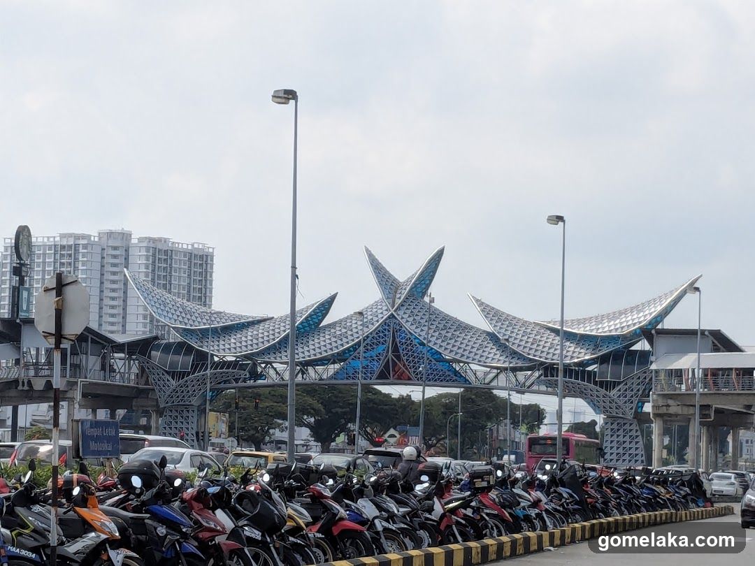 Motorcycle Parking Area Near Modern Architectural Structure
