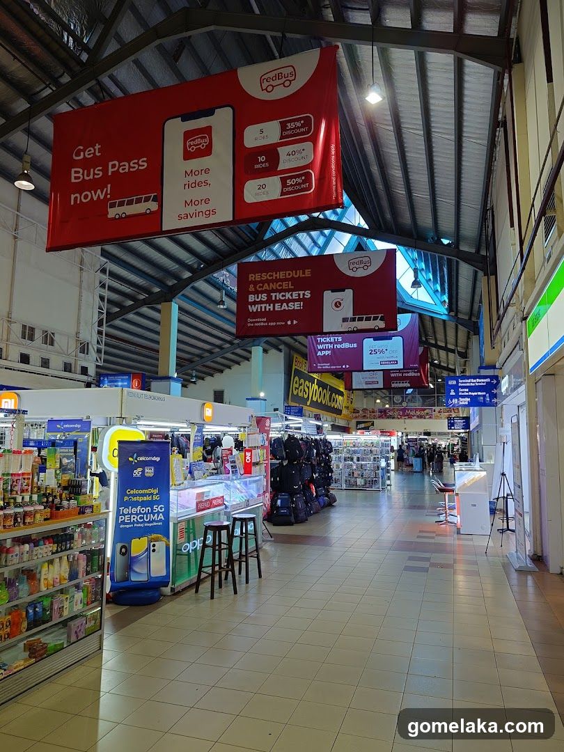 Bus terminal interior with advertisements