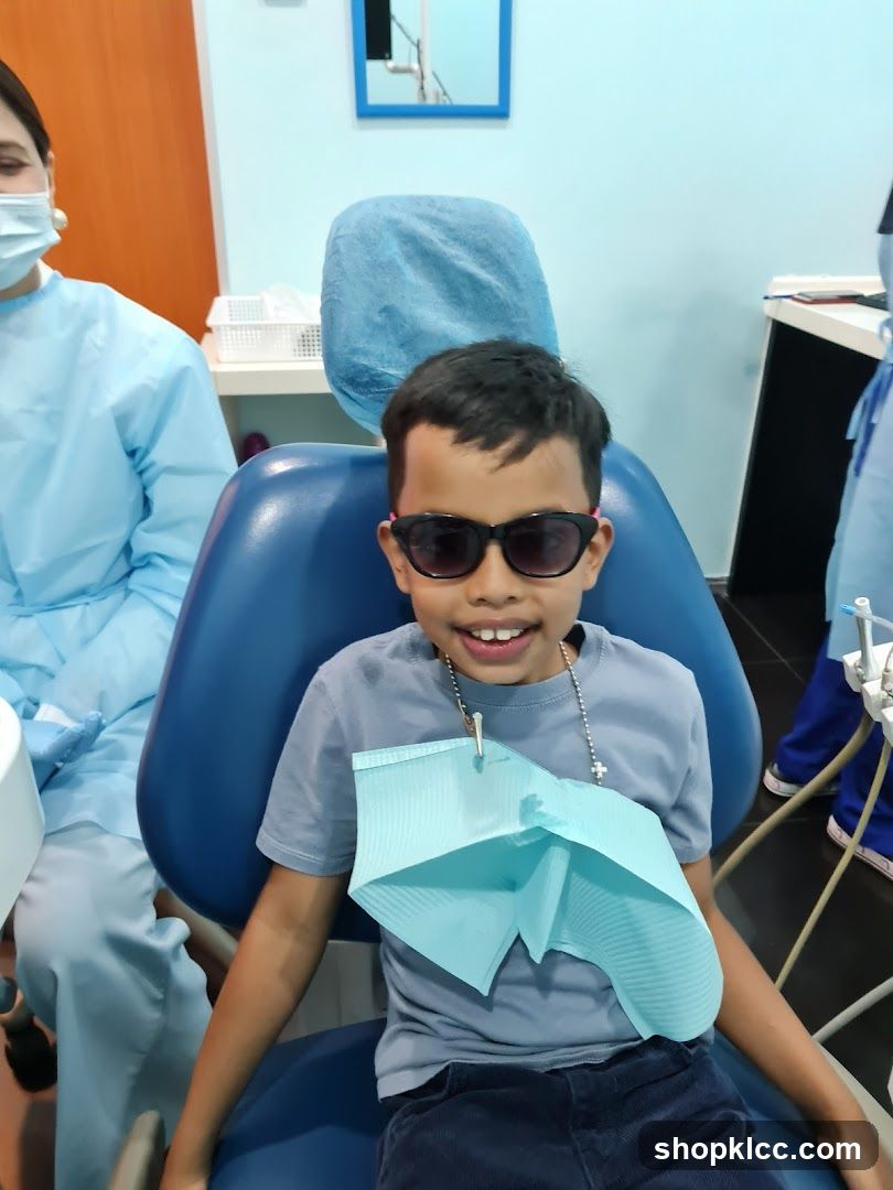 Child in Dental Chair with Sunglasses