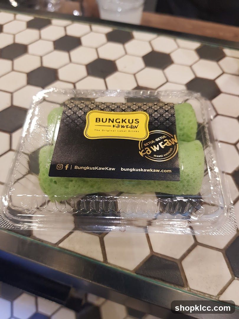 Green dessert rolls in a plastic container