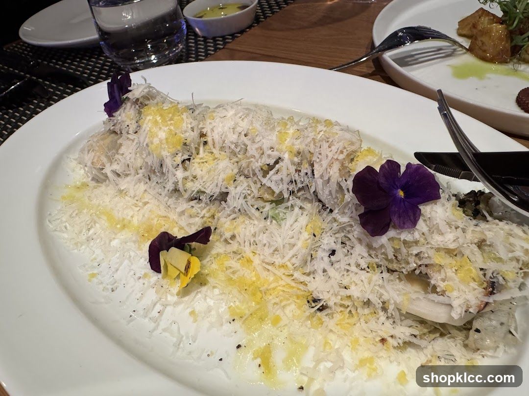 Gourmet Dish with Grated Cheese and Edible Flowers