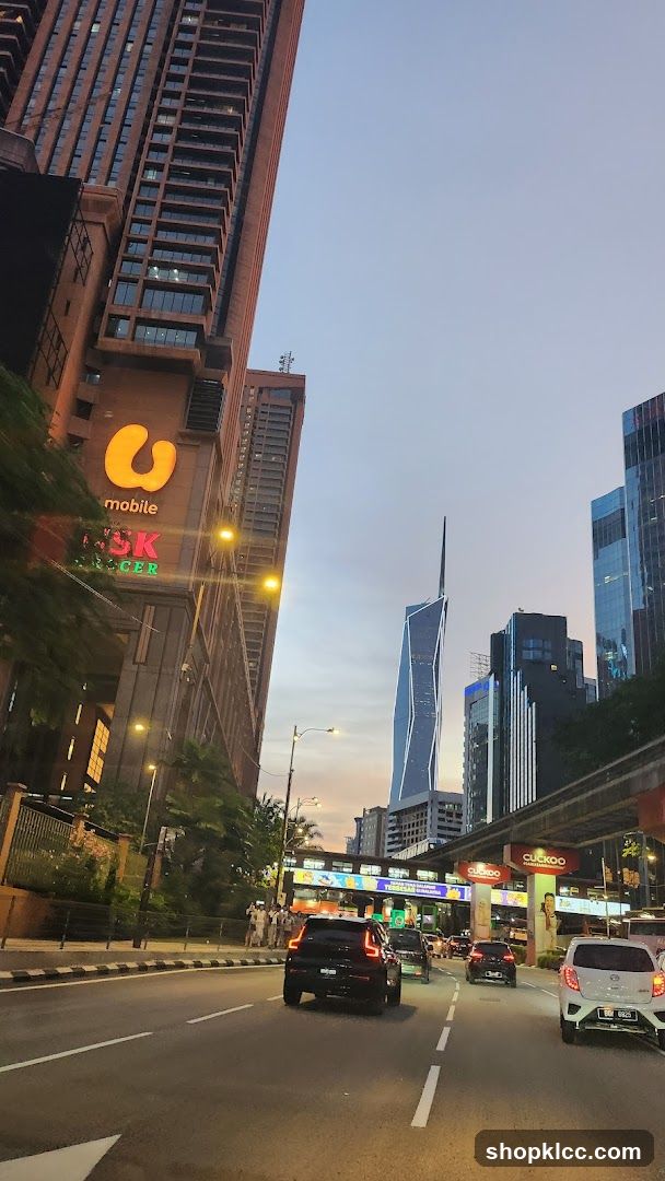 Cityscape at Dusk with Tall Buildings and Traffic
