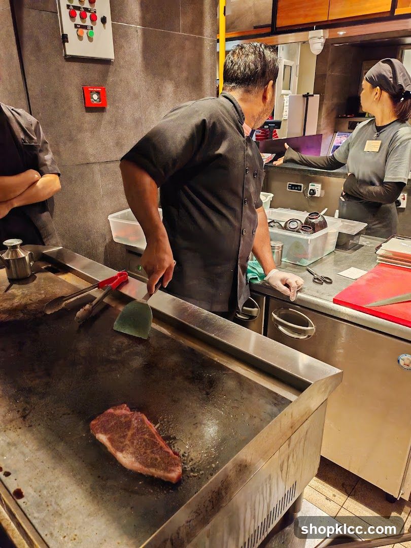 Chefs cooking steak