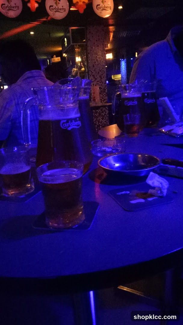 Bar scene with beer pitchers and glasses