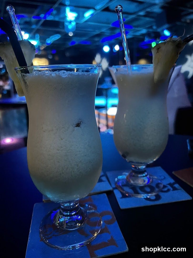 Two Pina Coladas on a Table