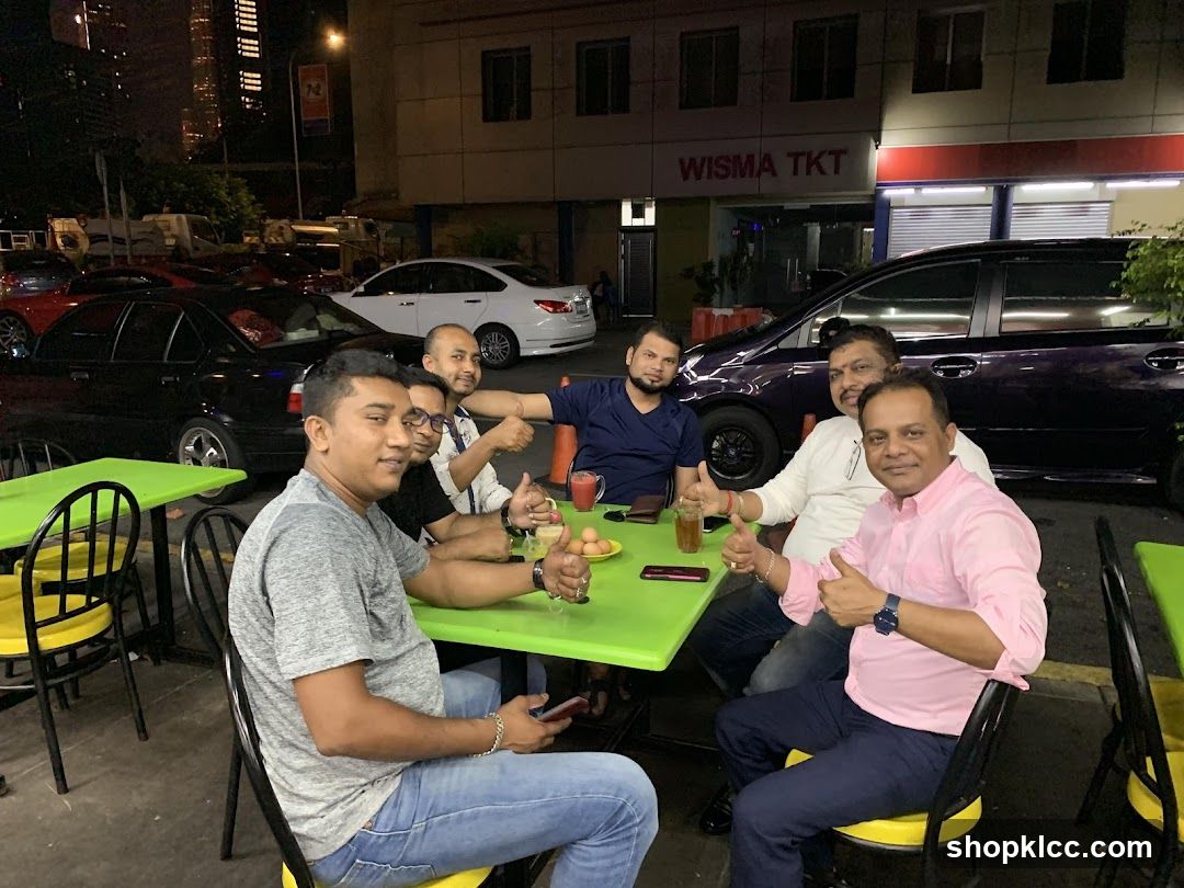 Group of men dining outdoors