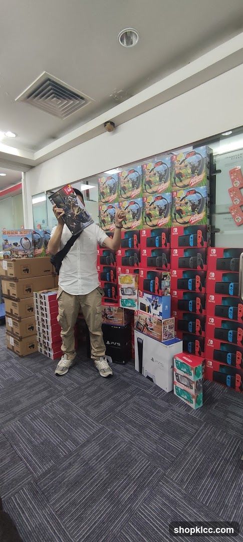 Man holding a game box in a store