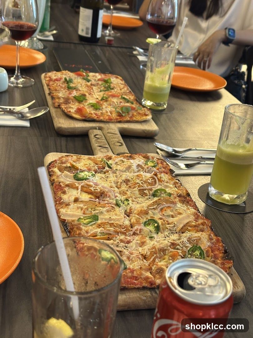 Pizzas and Drinks on Table
