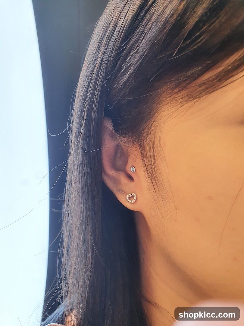 Close-up of a woman's ear with piercings