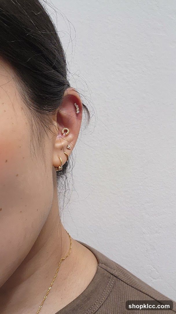 Woman's Ear with Multiple Piercings
