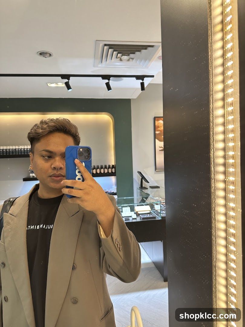 Man taking a mirror selfie in a store