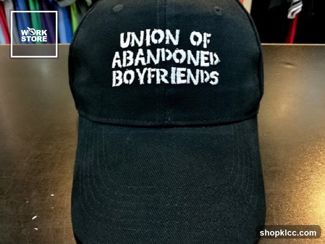 Black baseball cap with white text