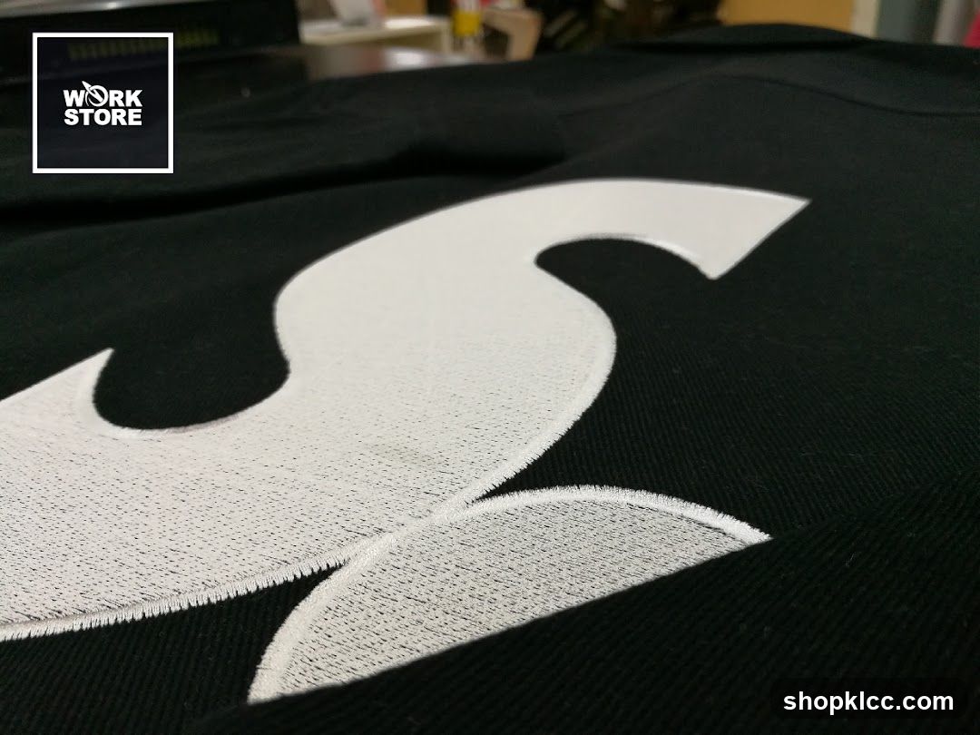 Embroidered Logo on Black Fabric