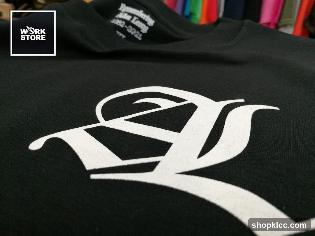 Black T-shirt with white graphic and text