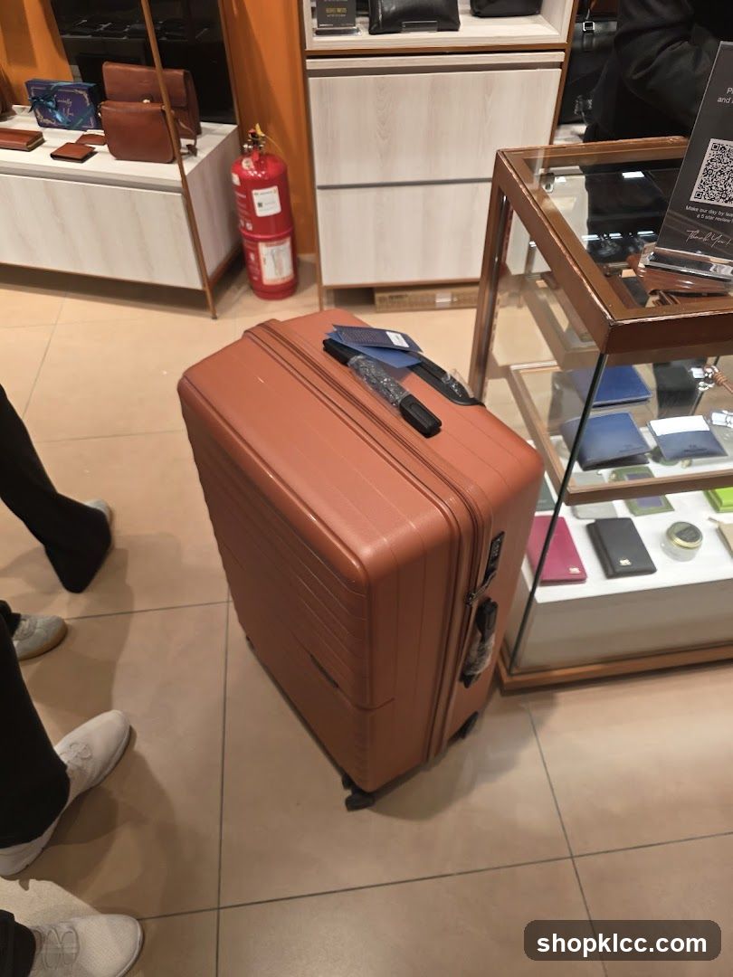 Orange Suitcase in Store