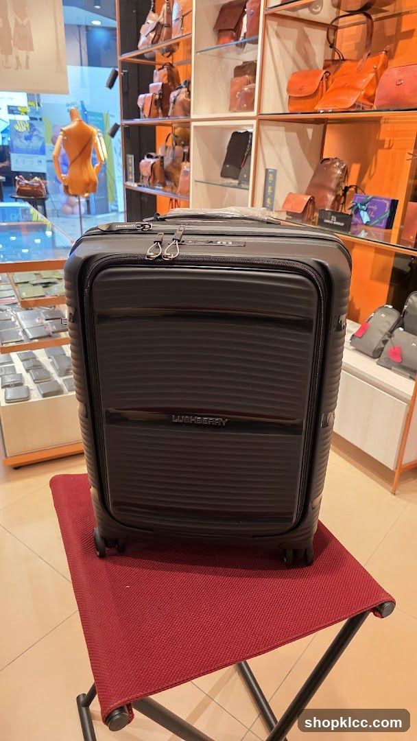 Luggage on a red stool in a store