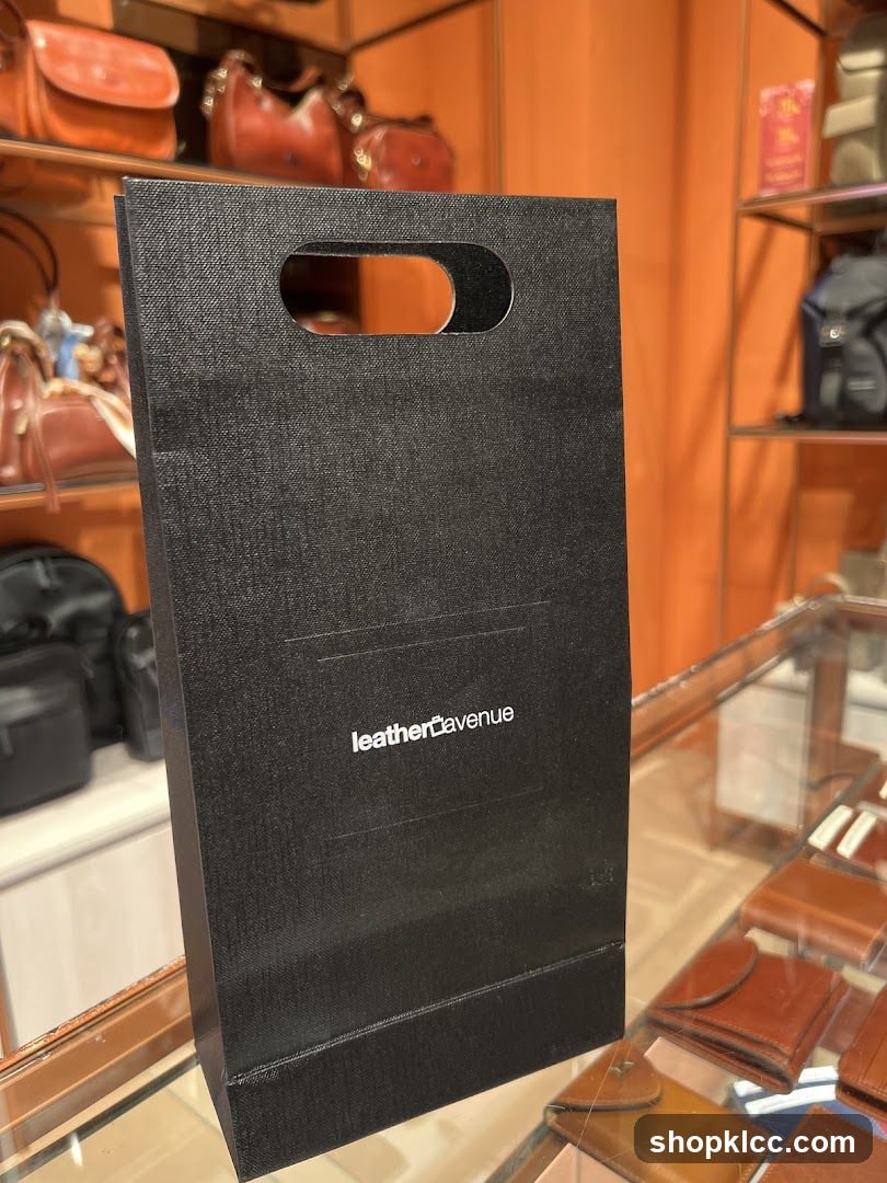 Black shopping bag with logo