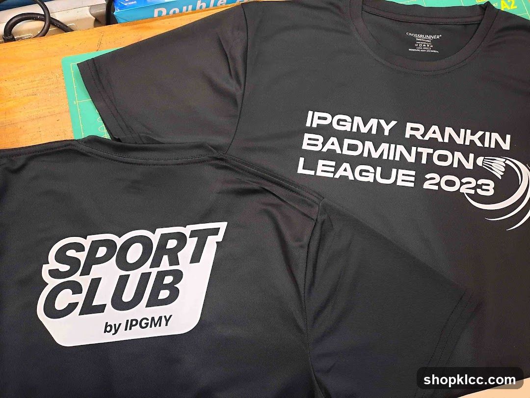 Black T-shirts with white text and logos