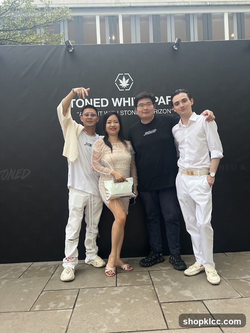 Group Posing in Front of a Branded Backdrop