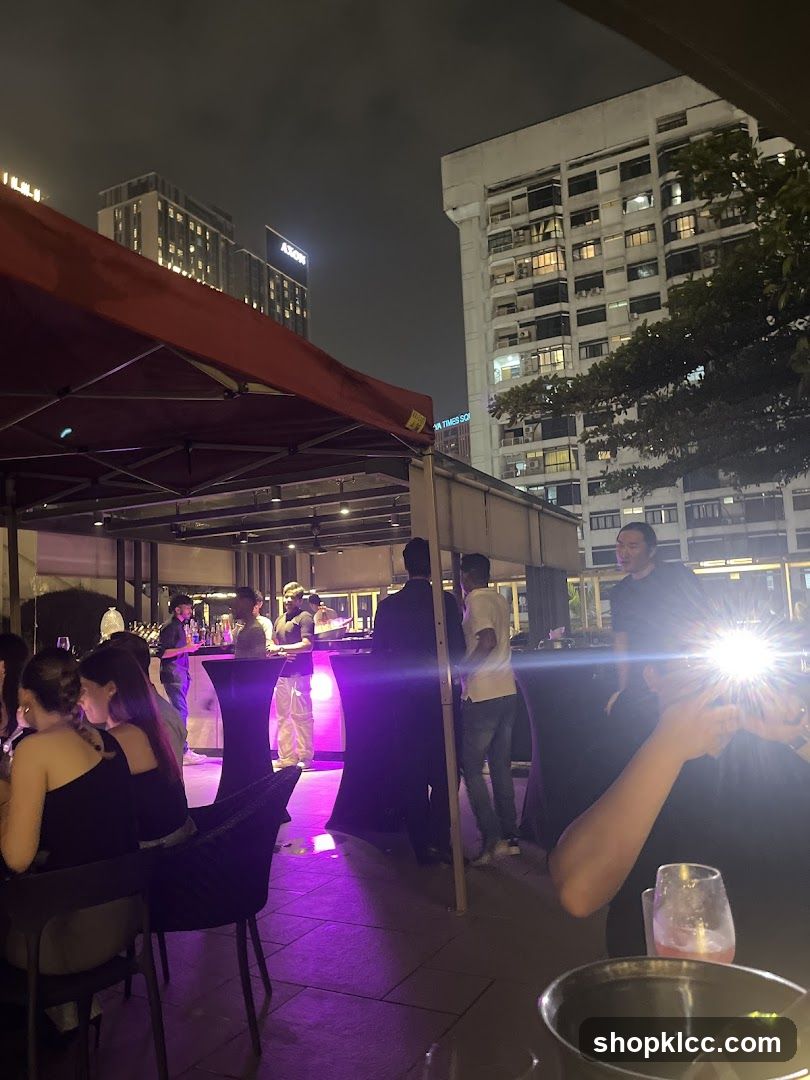 Outdoor gathering with people and buildings at night