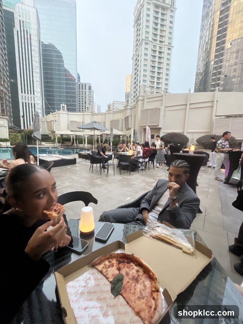 People eating pizza at an outdoor event