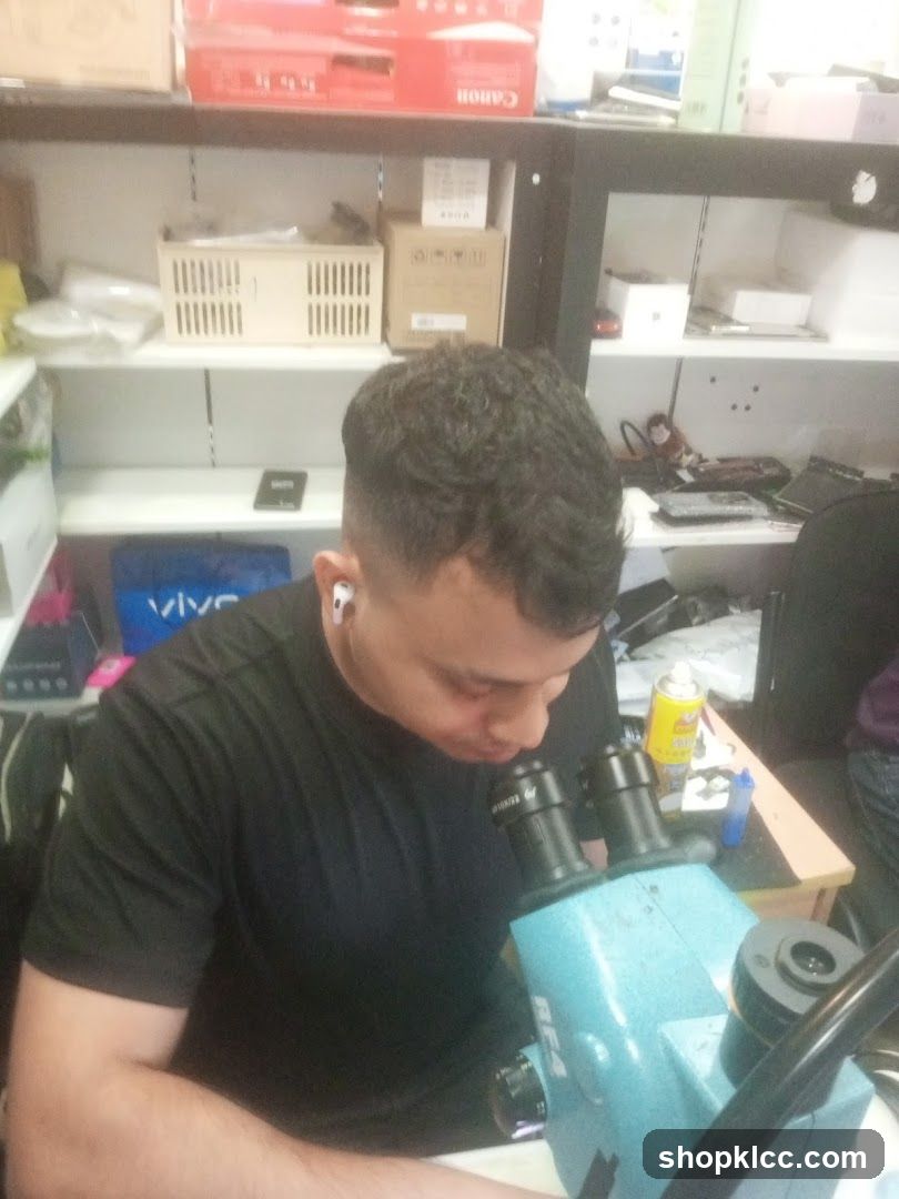 Man working with a microscope
