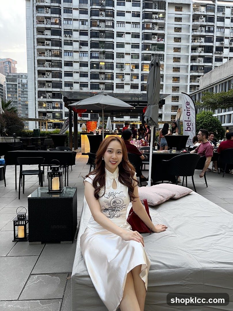 Woman in Cheongsam at Rooftop Bar
