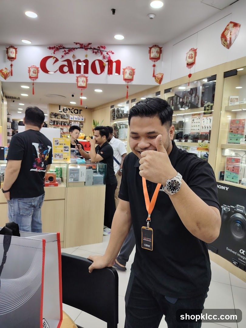 Man giving a thumbs up in a camera store