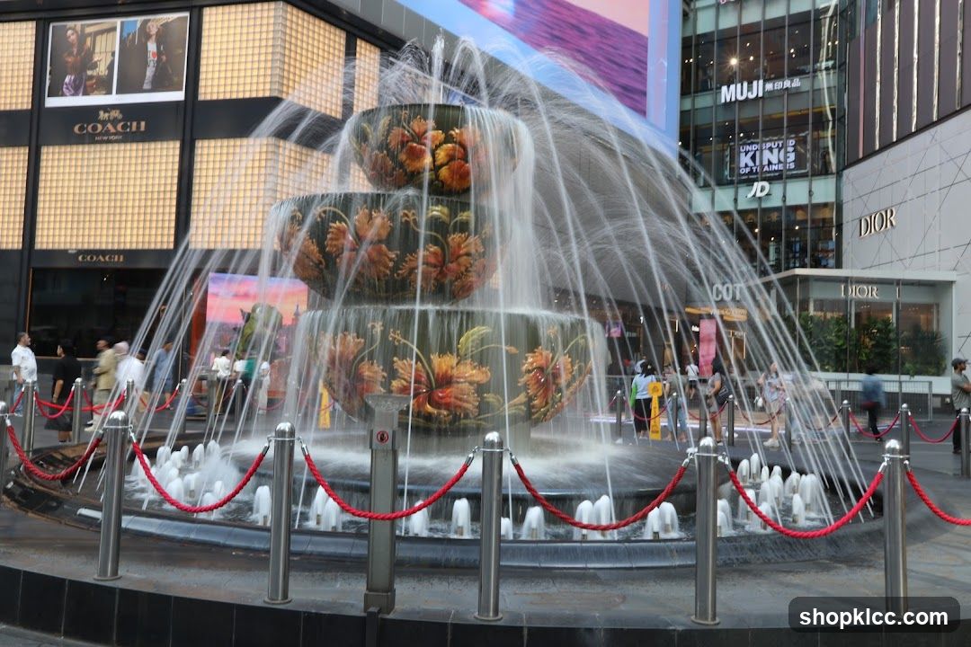 Fountain in front of shops