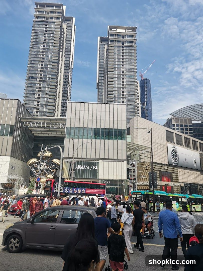 Busy street scene with tall buildings and shops