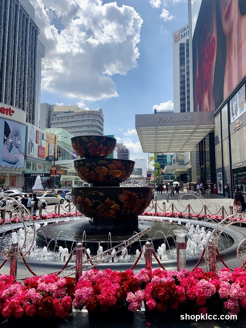 Fountain with Flowers and Cityscape
