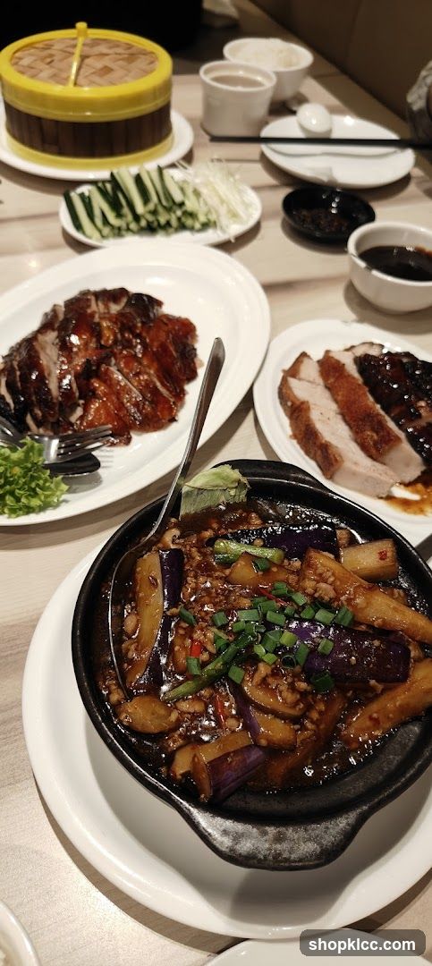 Table with Roasted Duck and Eggplant Dish